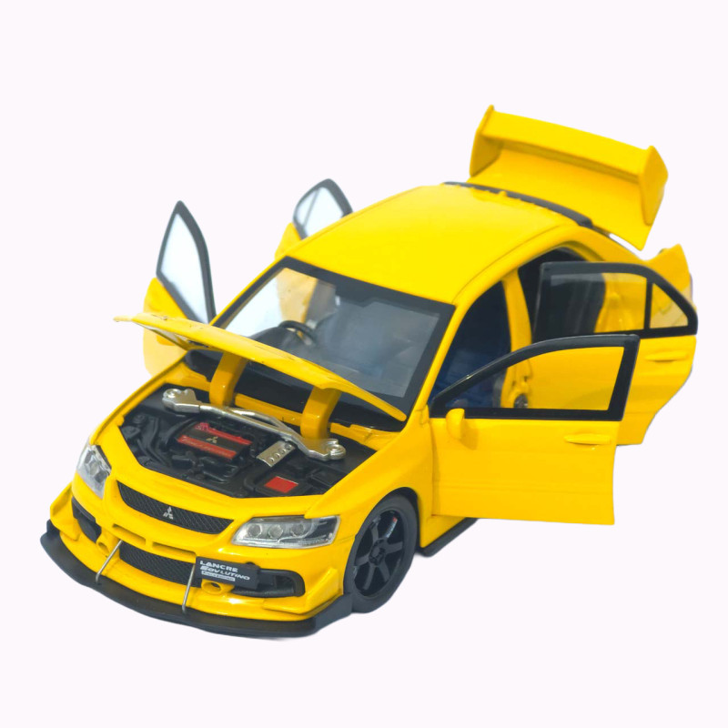 Машинка металл Mitsubishi Lancer Evolution IX желтая 1:32 свет звук инерция откр двери баг капот 15*5,5*4,5см (TK-20651)