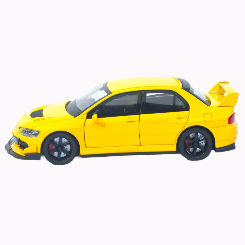 Машинка металл Mitsubishi Lancer Evolution IX желтая 1:32 свет звук инерция откр двери баг капот 15*5,5*4,5см (TK-20651)