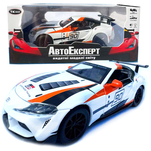 Машинка Toyota GR Supra GT4 Concept біло-оранджева Тойота 1:32 світло звук інерція відч двері баг капот 15*7*4,5см (21423)