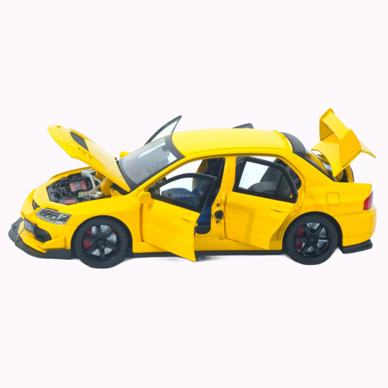 Машинка металл Mitsubishi Lancer Evolution IX желтая 1:32 свет звук инерция откр двери баг капот 15*5,5*4,5см (TK-20651)