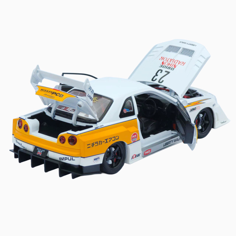 Машинка метал Nissan Skyline GT-R (R34) АвтоЕксперт біла 1:24 звук світло відч двері капот багажник (2916-39)