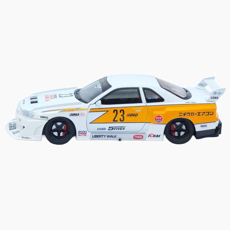 Машинка метал Nissan Skyline GT-R (R34) АвтоЕксперт біла 1:24 звук світло відч двері капот багажник (2916-39)