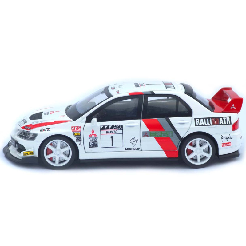 Машинка метал Mitsubishi Lancer Evolution IX біла 1:32 світло звук відч двері капот багаж (TK-13970)