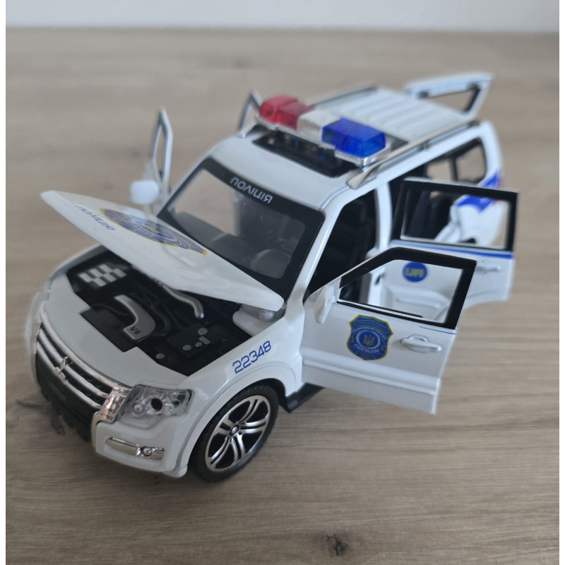 Машина металева поліція Mitsubishi Авто Експерт 1:32 світло звук інерція відч двері баг капот 15*6*6,5см (51282)