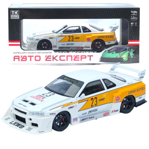 Машинка метал Nissan Skyline GT-R (R34) АвтоЕксперт біла 1:24 звук світло відч двері капот багажник (2916-39)